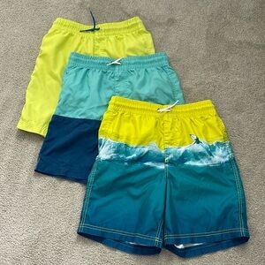 Three pair of boys Old Navy swim trunks, all size XL/ 14–16